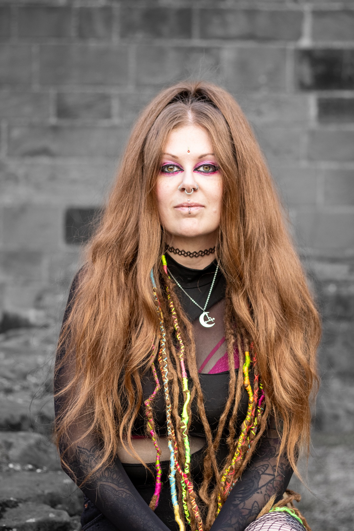 Outdoor portrait against Chester stonework