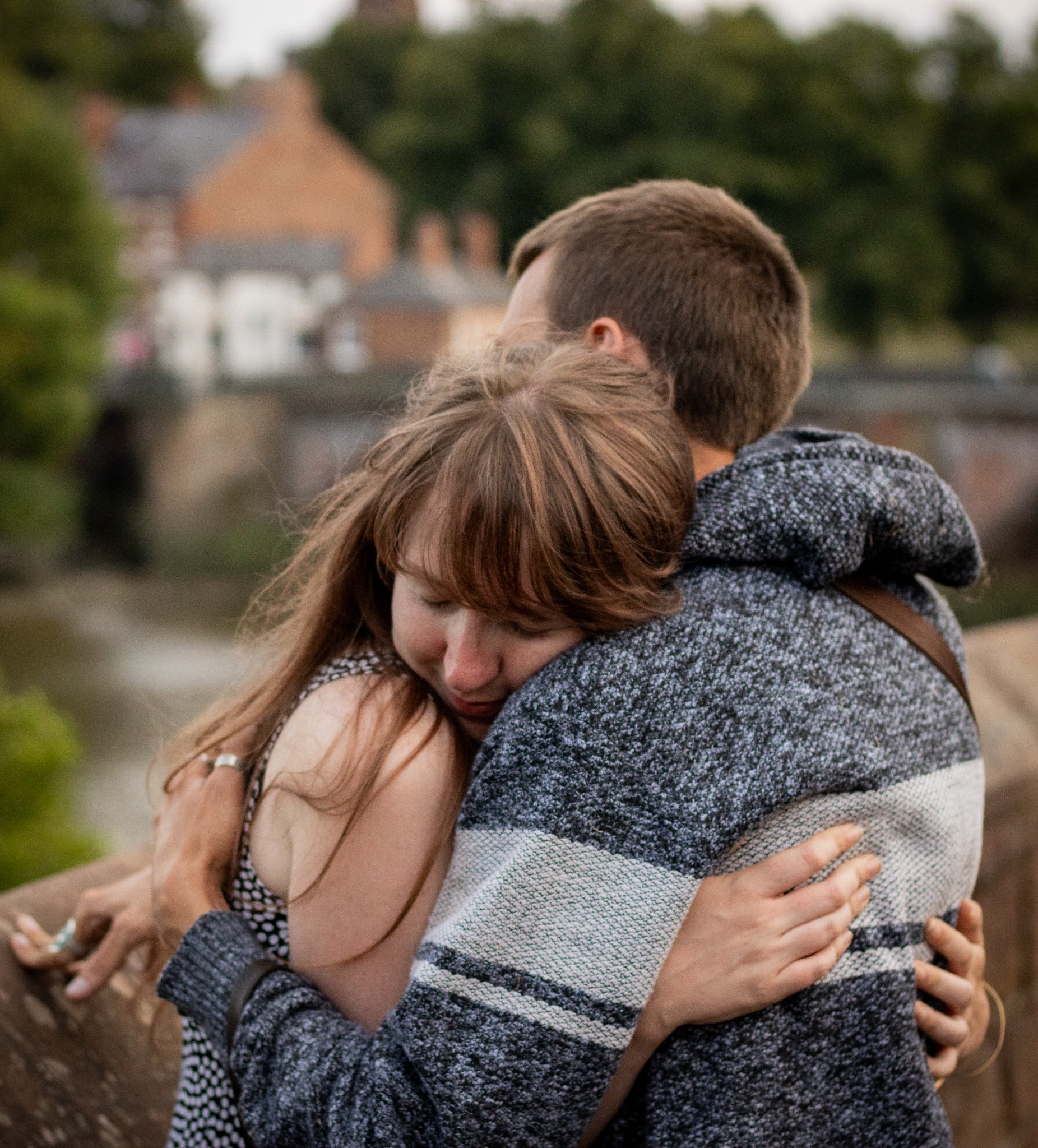 A couple sharing a hug outdoors